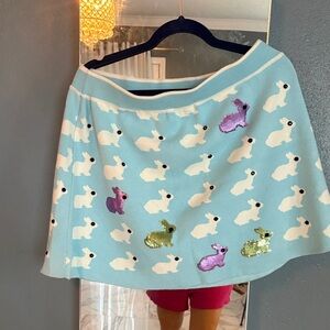 QUEEN OF SPARKLES Pink Satin Brand Tag on Light Blue Knit